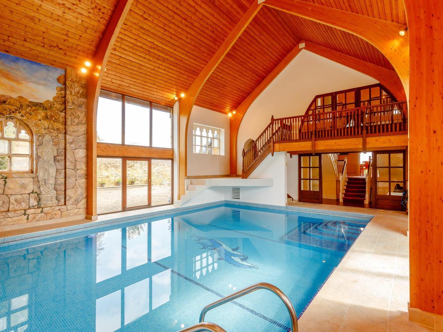 The stunning indoor pool is a highlight of this house. Photo: Fine and Country.