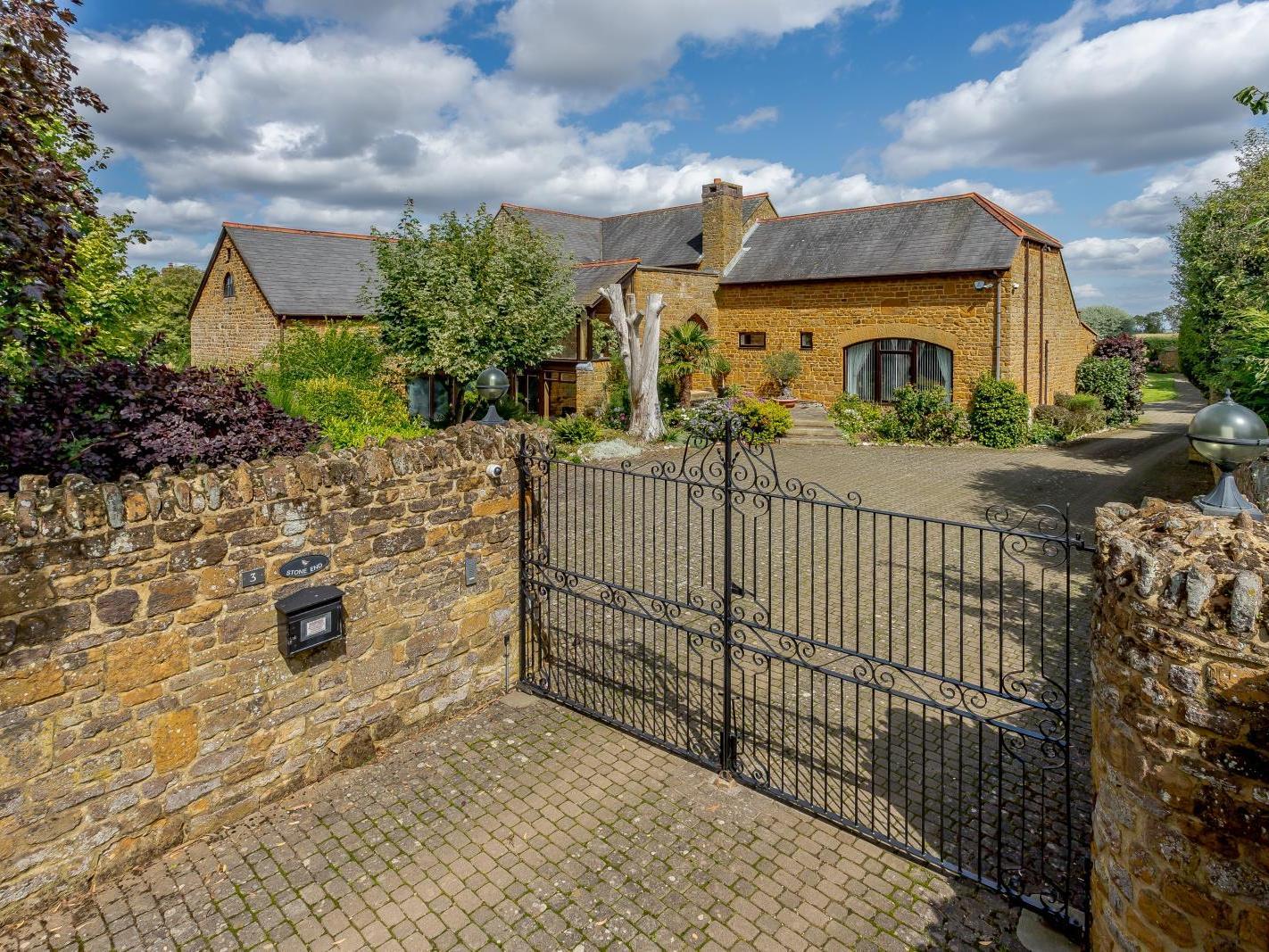 The house has electric gates. Photo: Fine and Country.