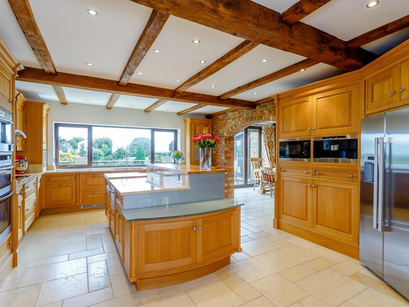 The kitchen is complete with an island. Photo: Fine and Country.