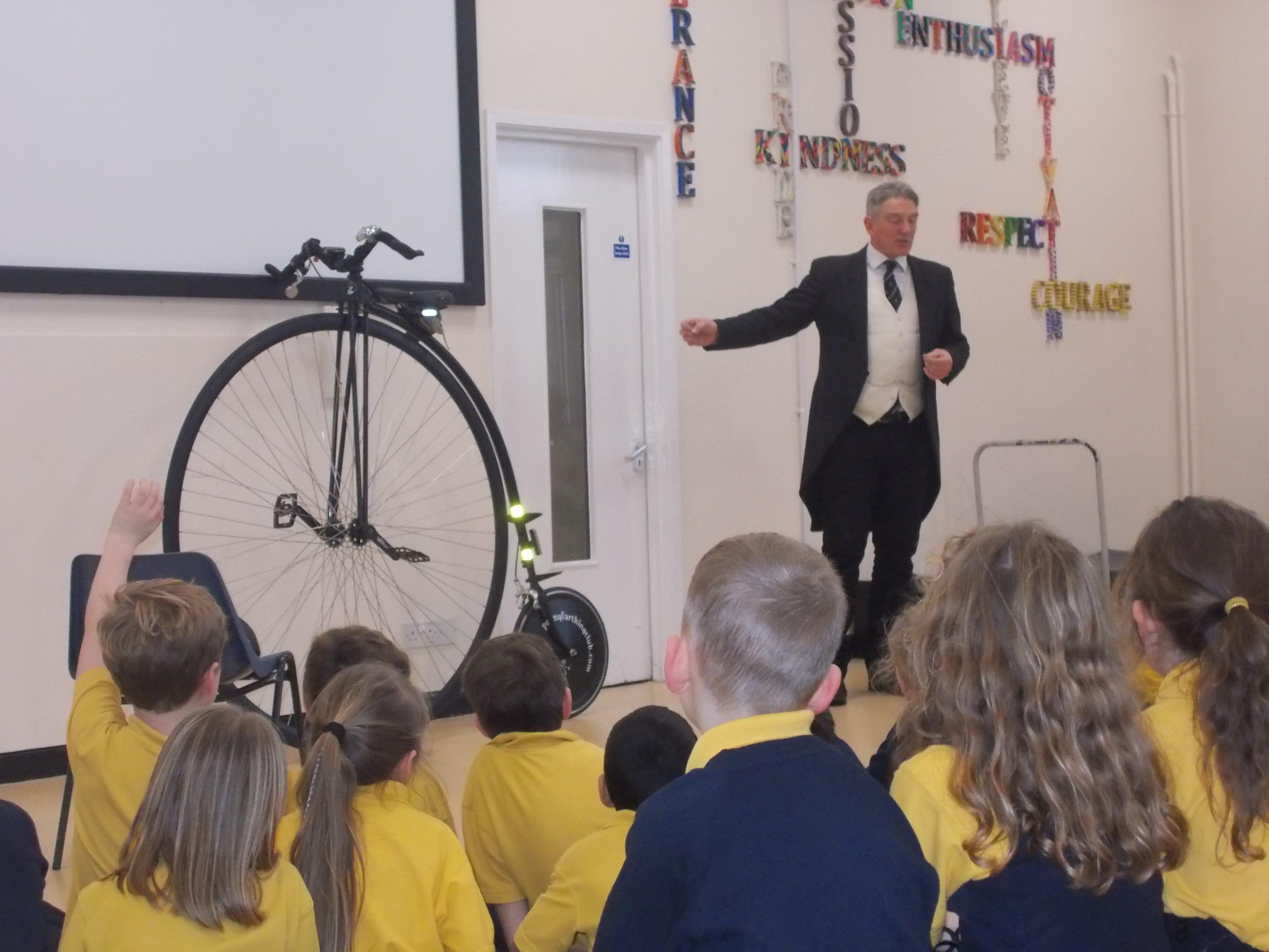 Neil Laughton, secretary of the Penny Farthing Club, came to visit Upper Beeding Primary School with his penny farthing bicycle SUS-200129-145320001