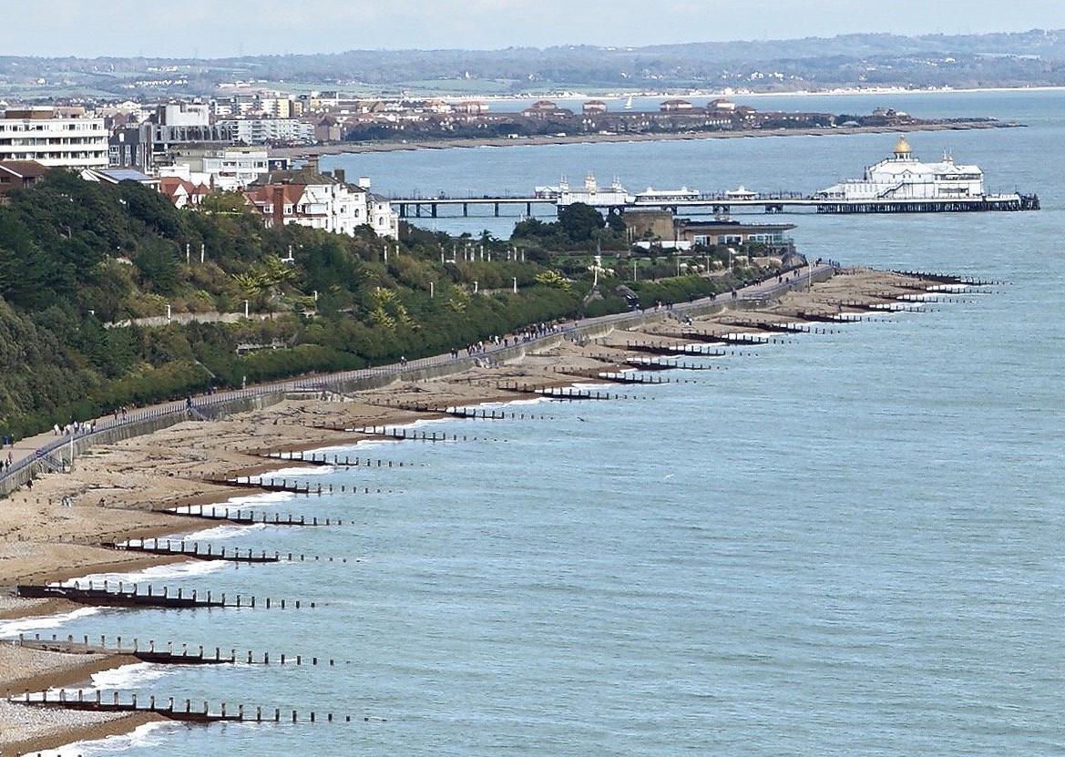 Holywell promenade and chalets with the pier in the far distance, by David Ford SUS-200129-111503001