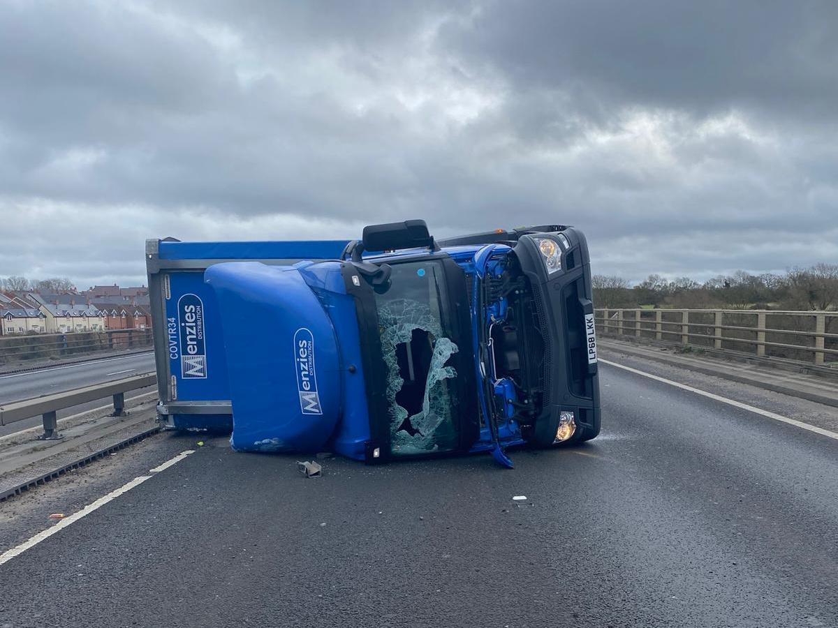 The A14 will be shut in both directions all day after a lorry tipped over.