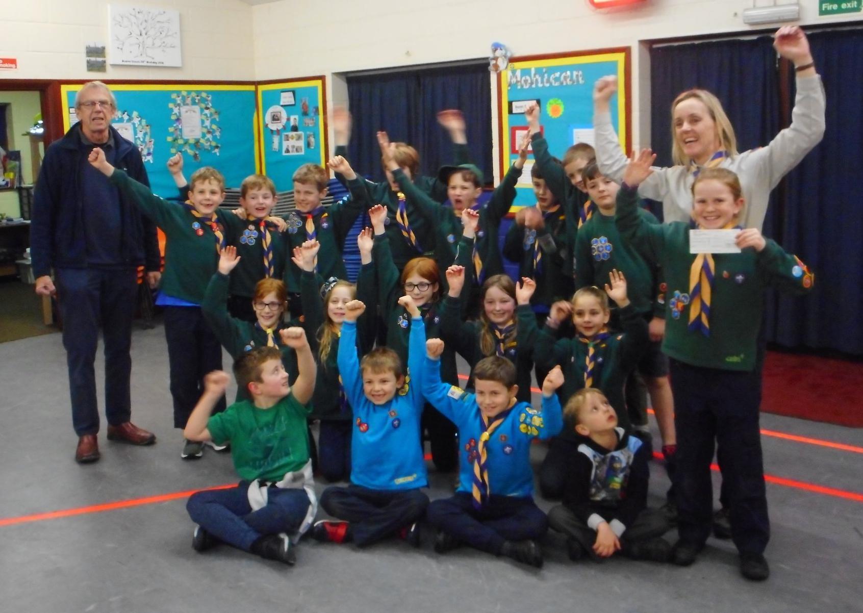 1st Sullington & Storrington  Scouts, Cubs & Beavers receiving a cheque for £1,000 from Rotarian Tony Vaughan SUS-201202-114626001