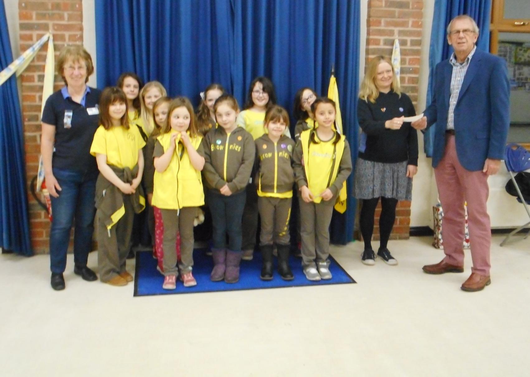 1st Storrington Rainbows and 2nd Storrington Brownies received a cheque for £500 from Rotarian Tony Vaughan SUS-201202-114615001