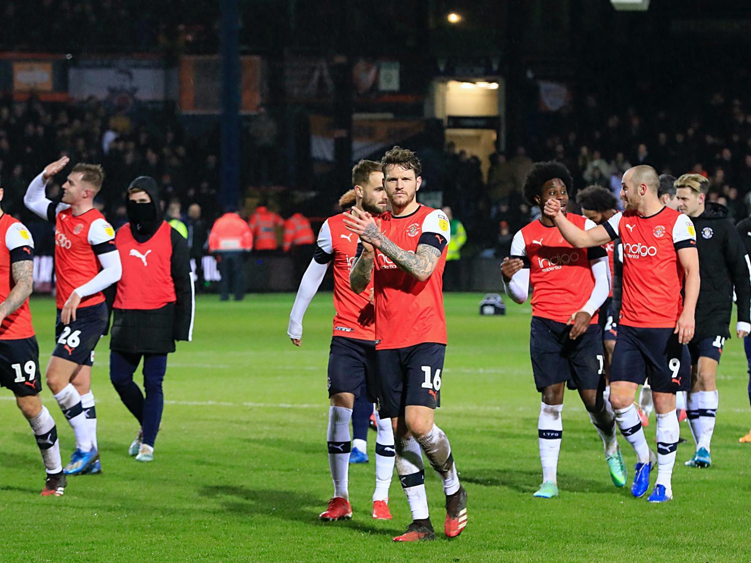 Glen Rea leads the applause after Town celebrate beating Sheffield Wednesday 1-0 at Kenilworth Road