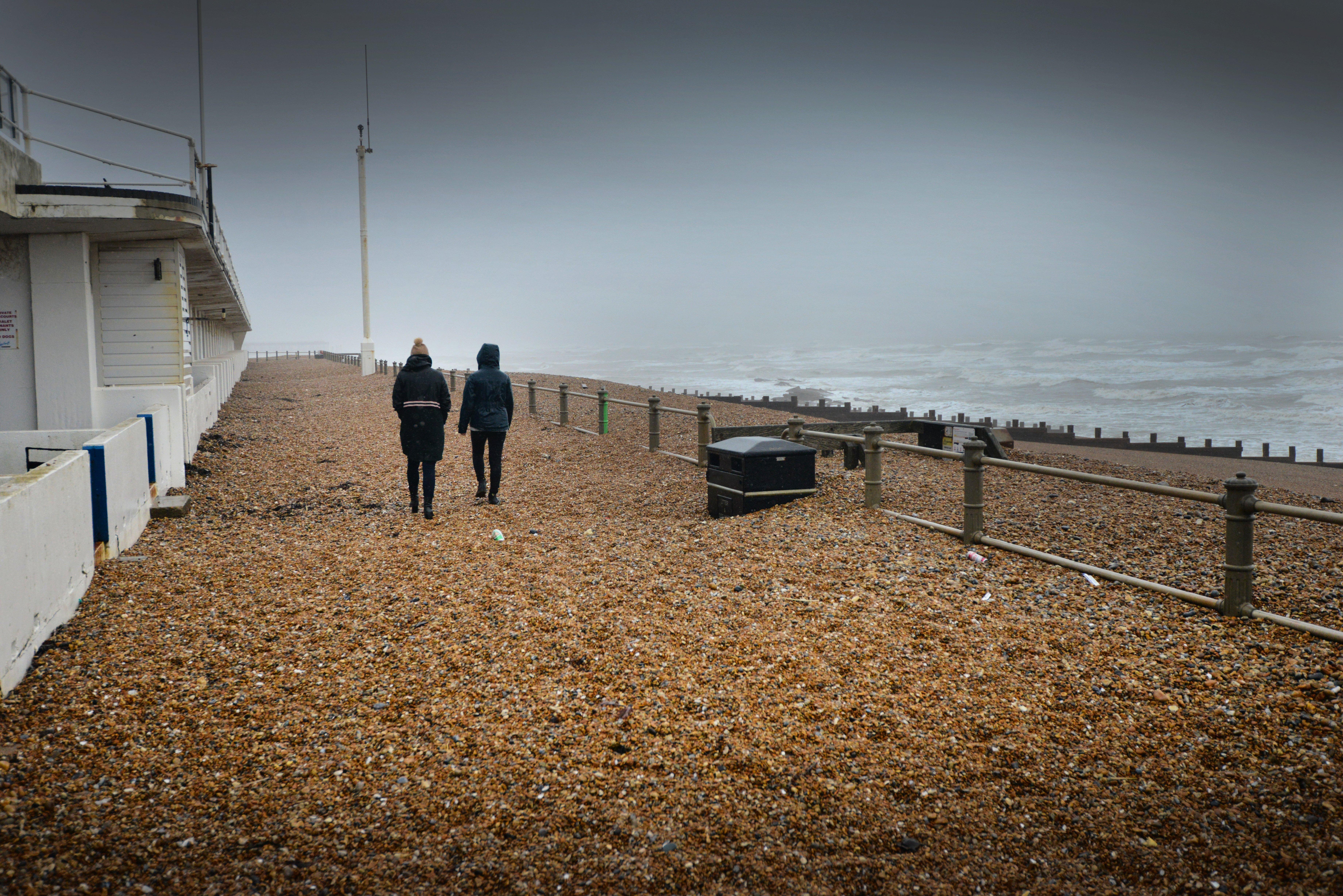 Shingle from Marina Beach covering the promanade, St Leonards, after the recent high winds. SUS-200216-104433001