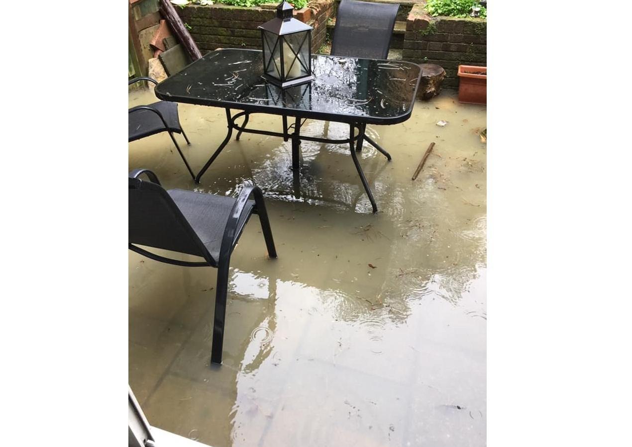 This patio was under a fair amount of water in North Heath Lane, Horsham SUS-200216-143707001
