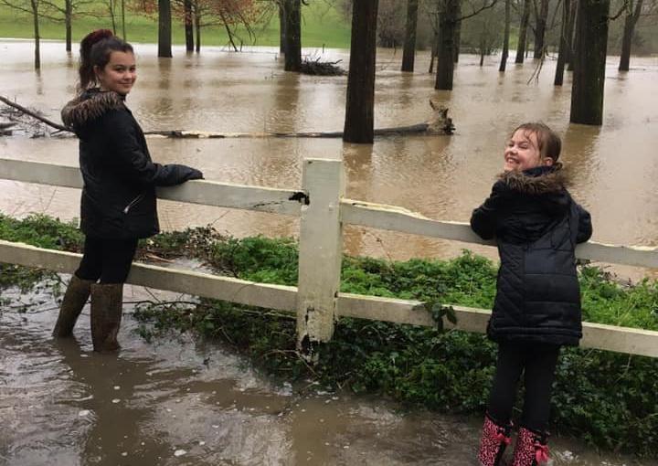 Samantha Robbins' daughters Jess (11) and Summer (8) admiring the flooding in Warrs Hill Lane, Lewes SUS-200216-162856001