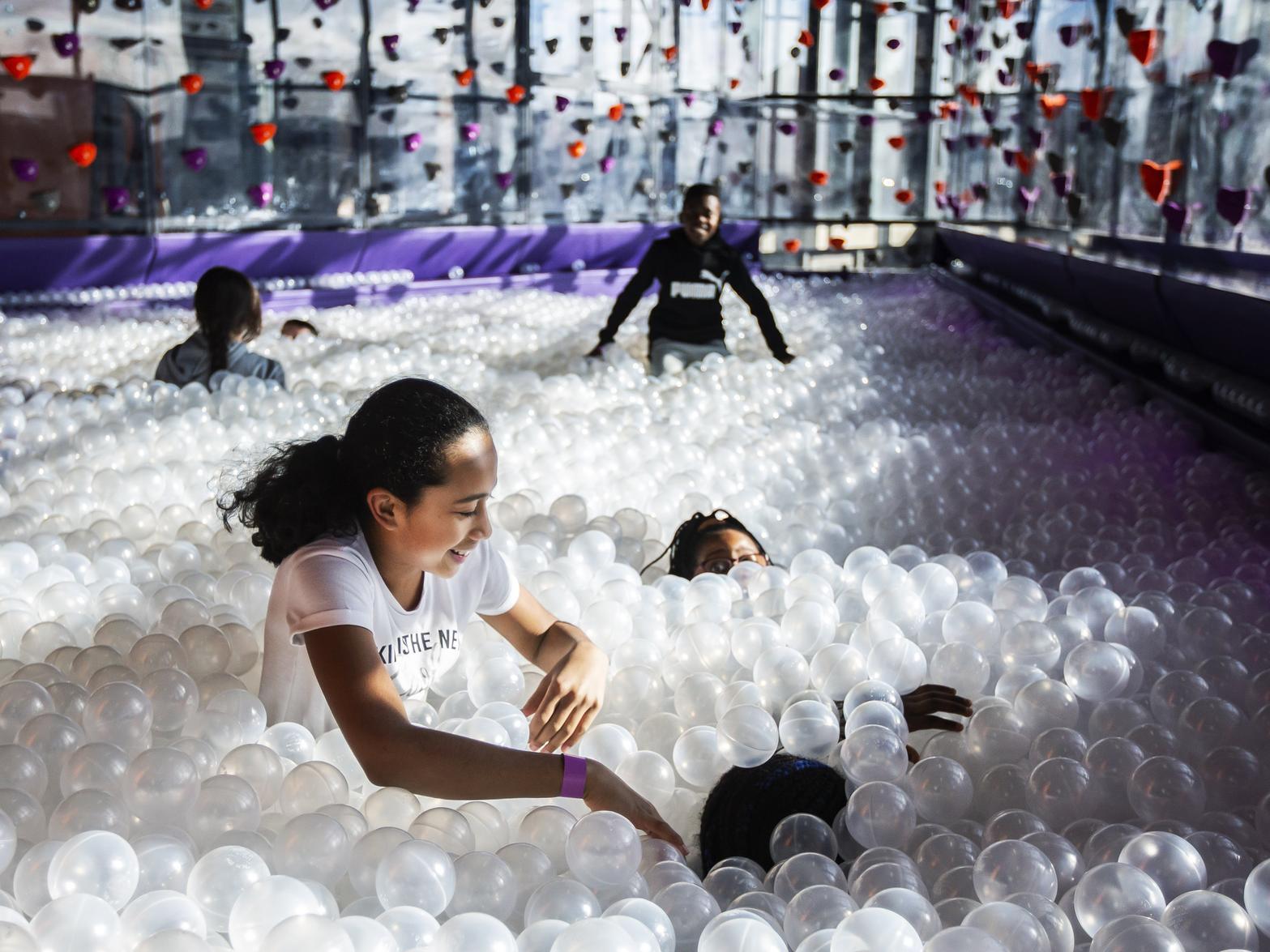 Kids enjoy the huge ball pit at Gravity in Sol Central