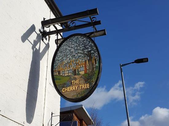The Cherry Tree sign left hanging. 
Photo by Annie Skelton.