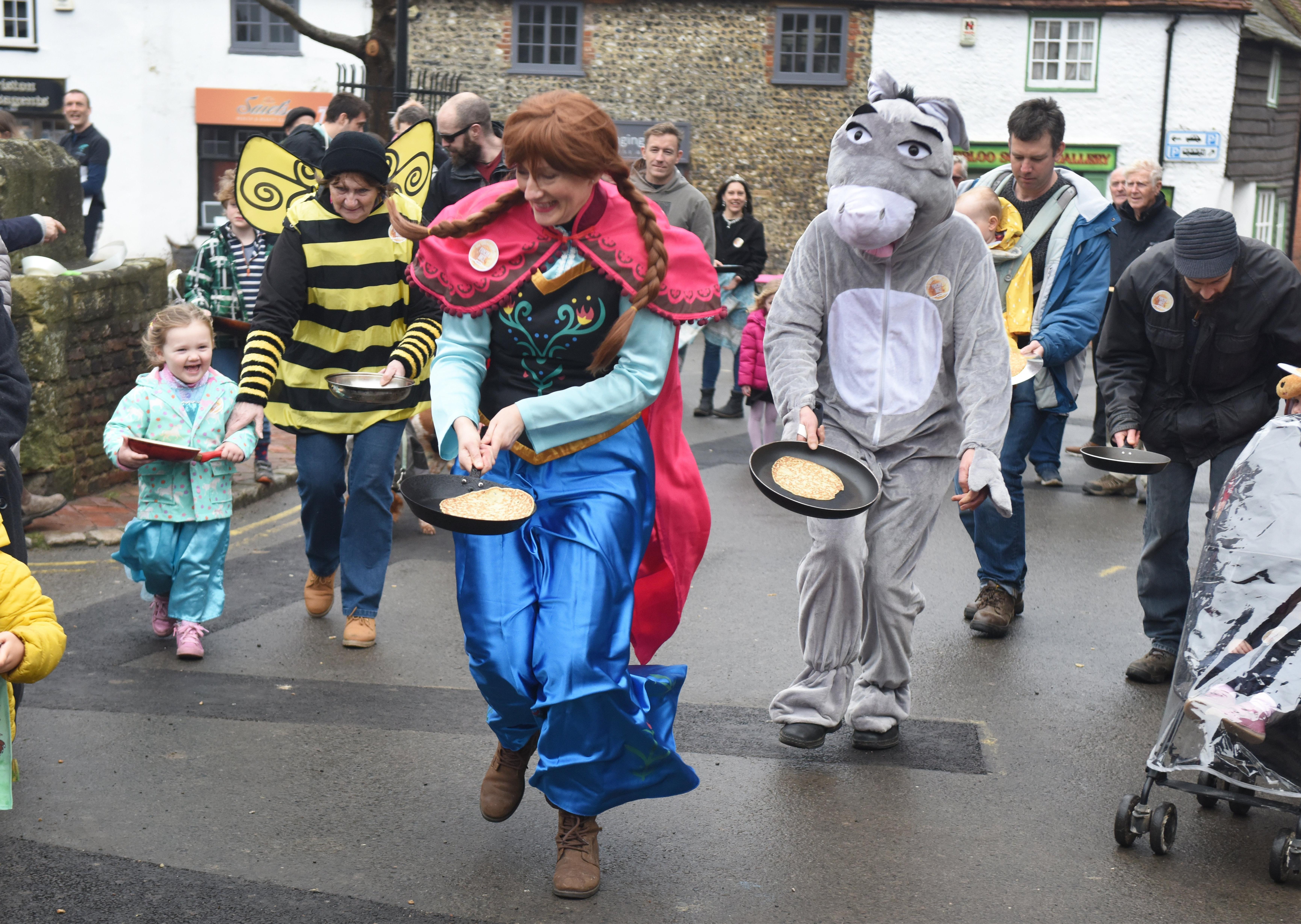 The first Great Alfriston Pancake Race. Photograph: Justin Lycett/SUS-200223-142257001