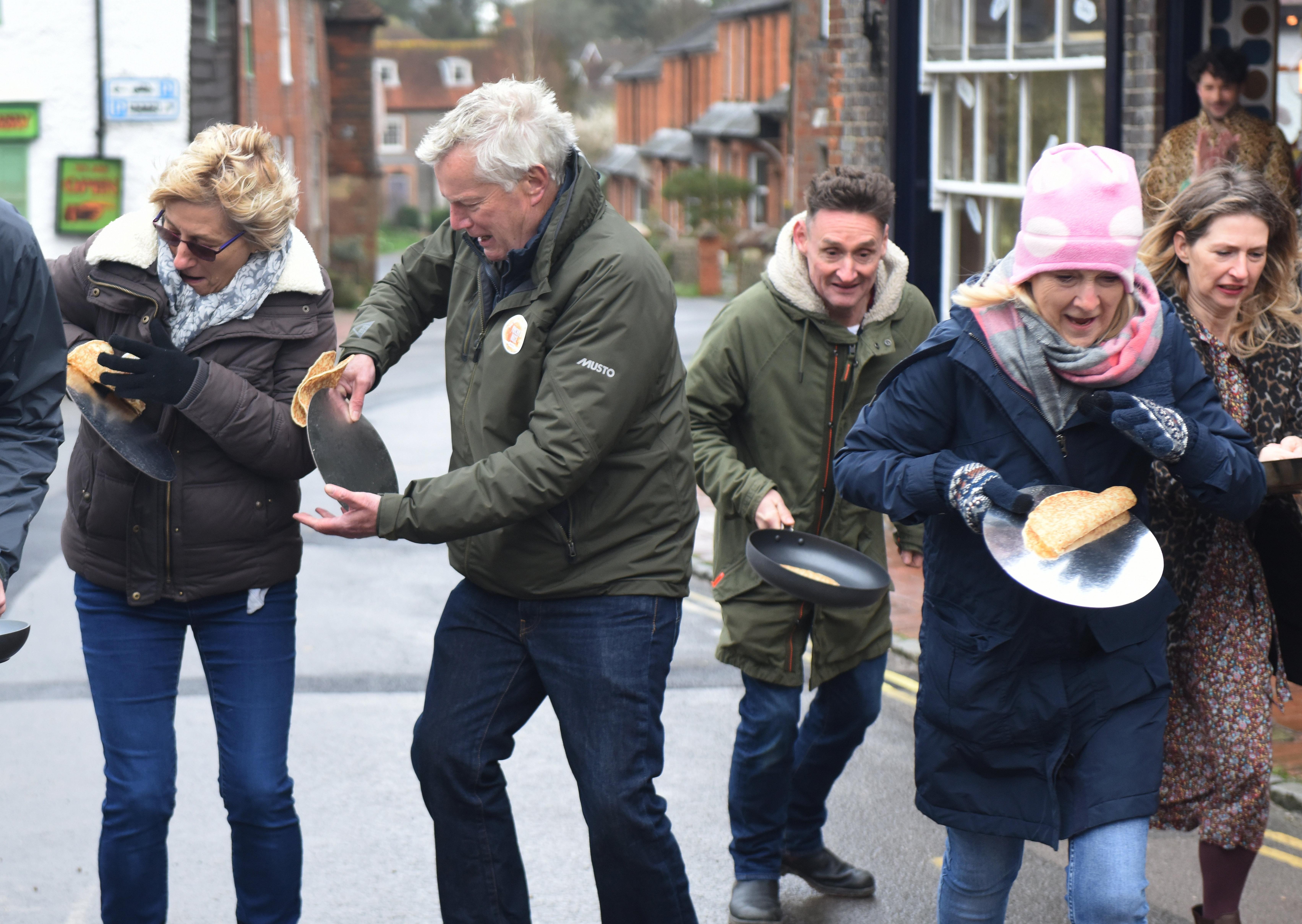 The first Great Alfriston Pancake Race. Justin Lycett/ SUS-200223-142523001