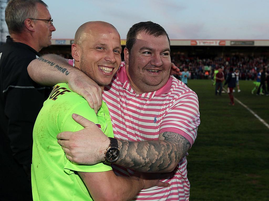 Matchwinner Luke Guttridge looks to be enjoying his post-match hug with Town supporter Chris Marriott