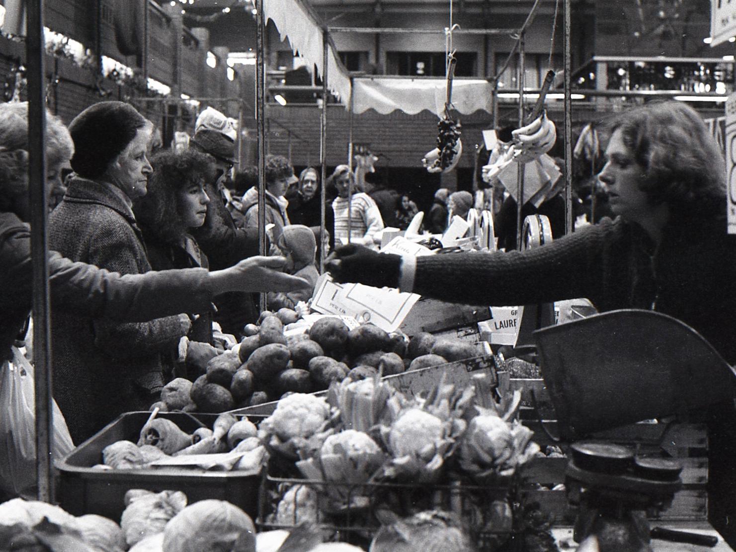 Busy shoppers at the vegetable stall. Photo: Living Archive MK