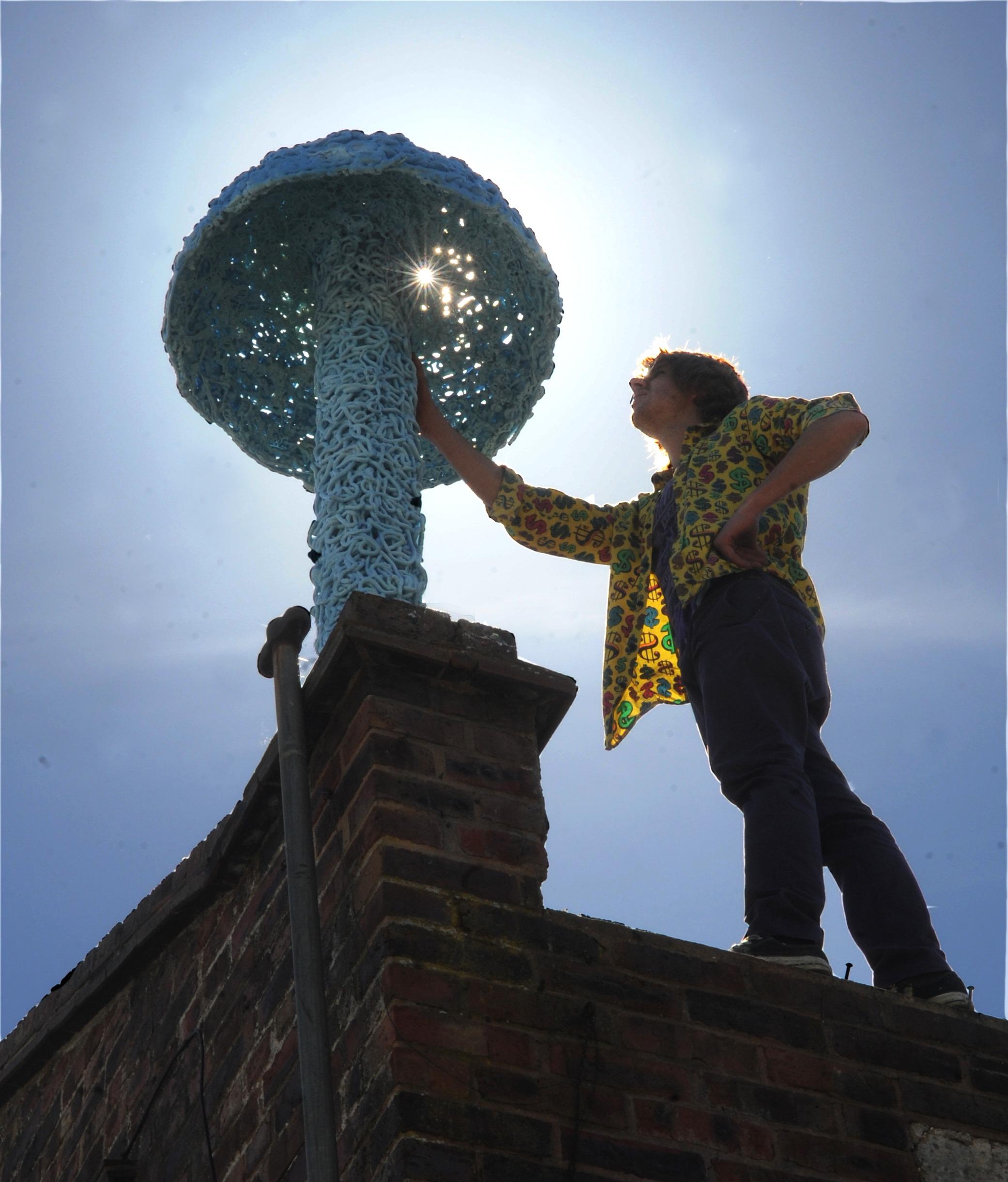 Rooftop art -  A street artists applies the finishing touches to his mushroom sculpture. 


Picture by Louise Adams C130629-1 Ent Street Art ENGSUS00120130705105105