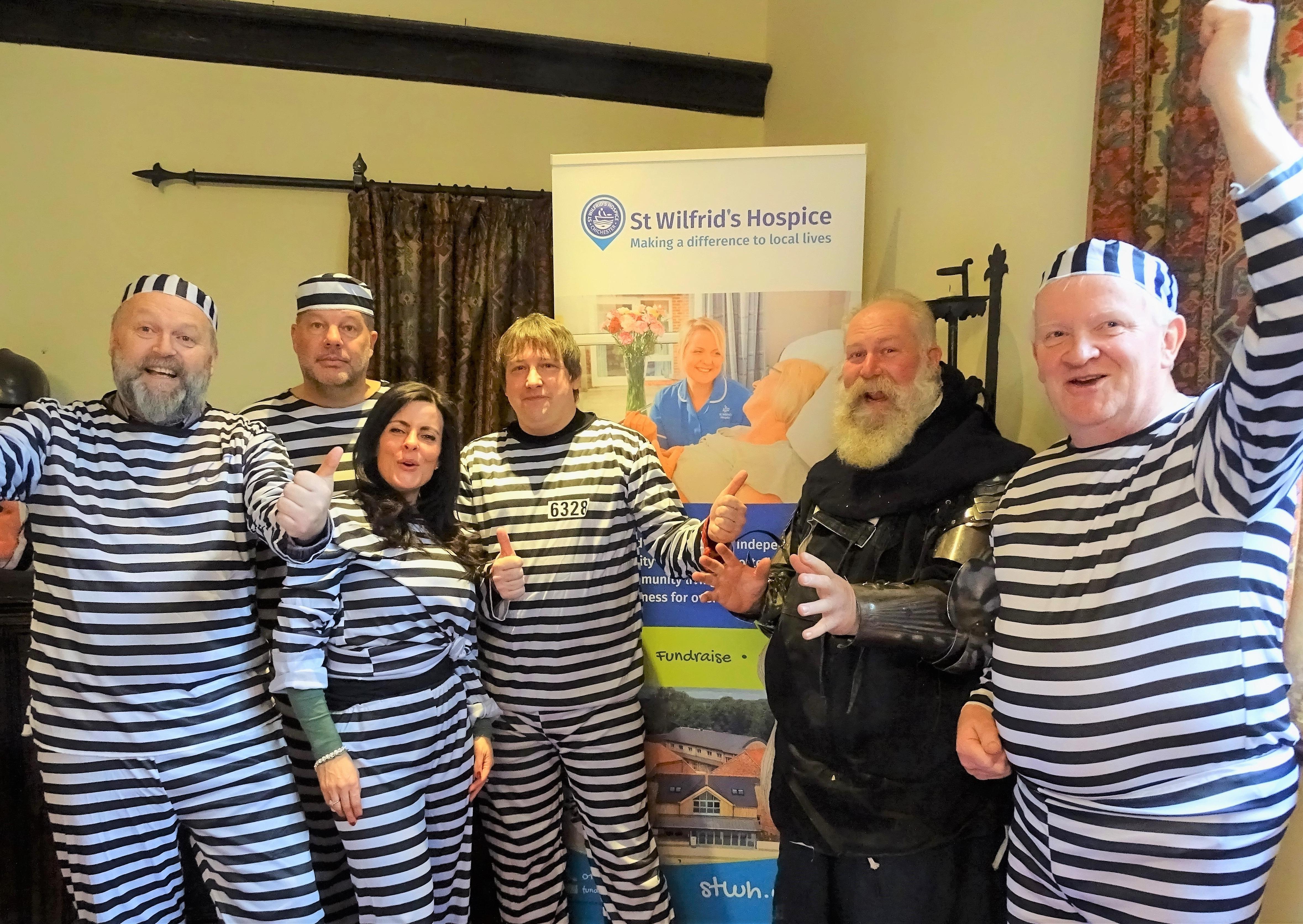 The St Wilfrid's Hospice Jail and Bail inmates with jailer Chris Blatch-Gainey at Amberley Castle