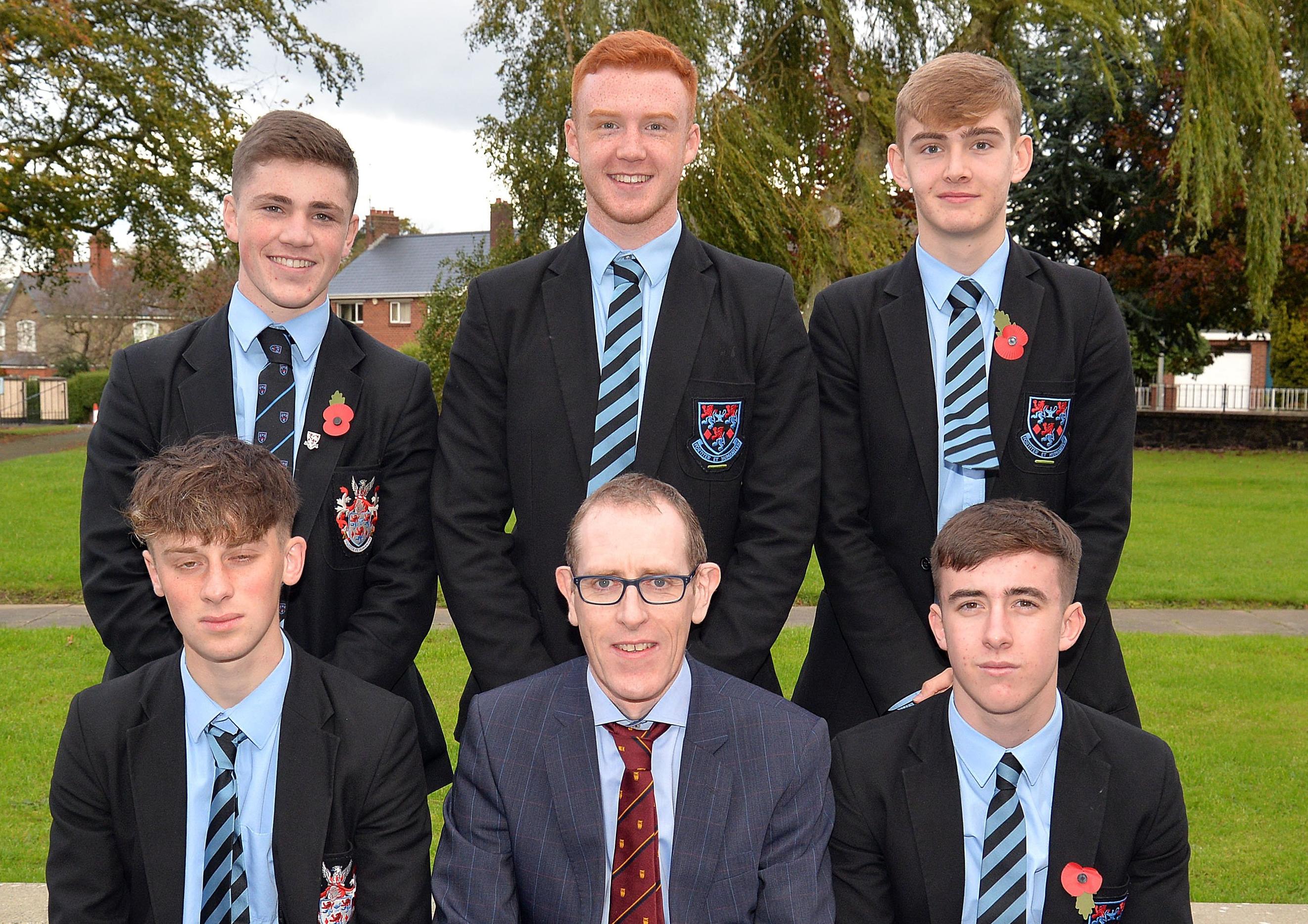 Portadown College vice principal, Mr Peter Richardson pictured with pupils who received School Colours for Football at the annual Speech Day. INPT44-212.