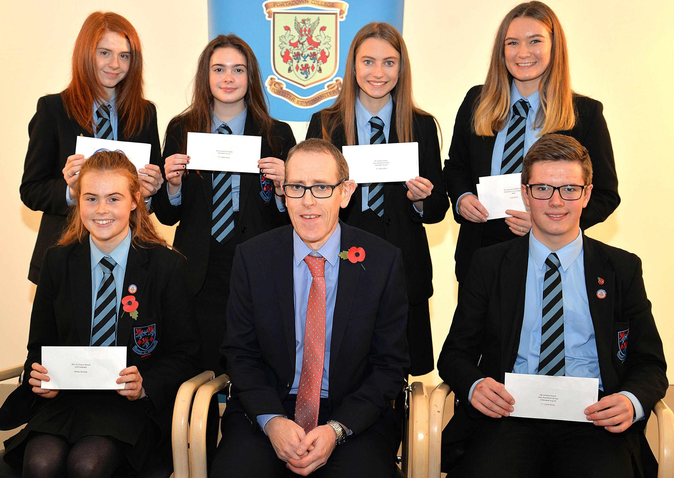 Vice principal, Mr Peter Richardson pictured with some of the 'A' level subject prizewinners at the school Speech Day. Included are back row from left, Suzanne Webb, Spanish, Amelie Dobson, English, Ellen Wilson, Religious Studies,  and Cassia Herron, Chemistry. Front from left, Meadow McCauley, Geography and Andrew Martin, Agriculture and Land Use. INPT44-219.