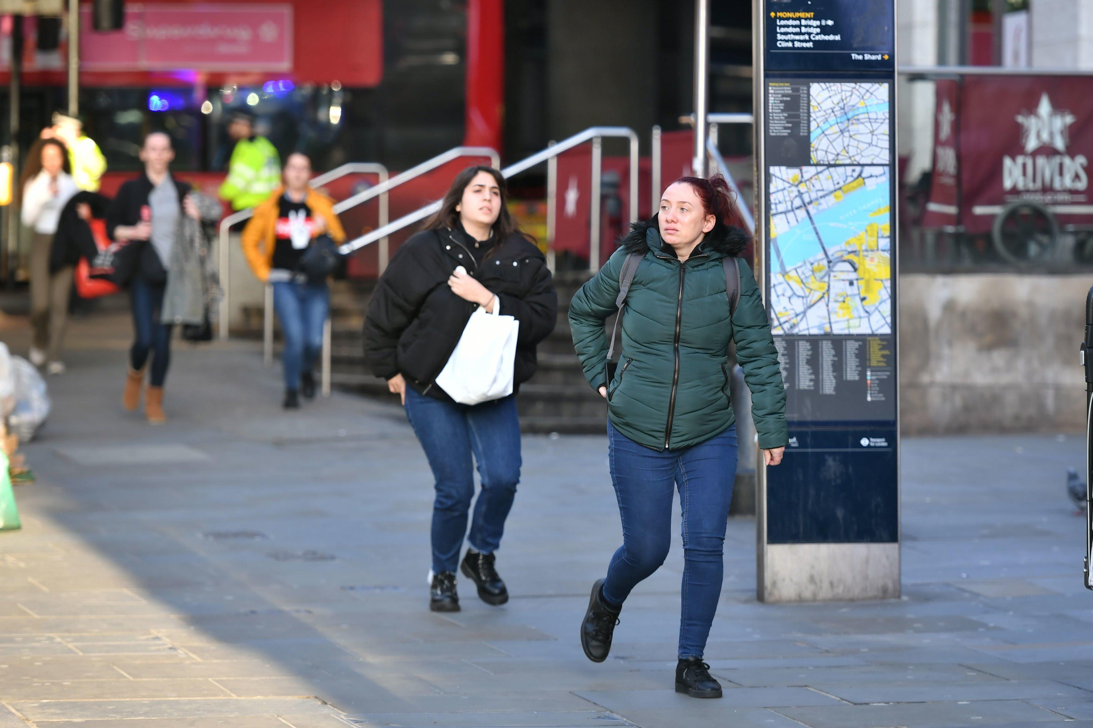 People heading away from the vicinity of Borough Market in London after police told them to leave the area. PA Photo. Picture date: Friday November 29, 2019. See PA story POLICE LondonBridge. Photo credit should read: Dominic Lipinski/PA Wire