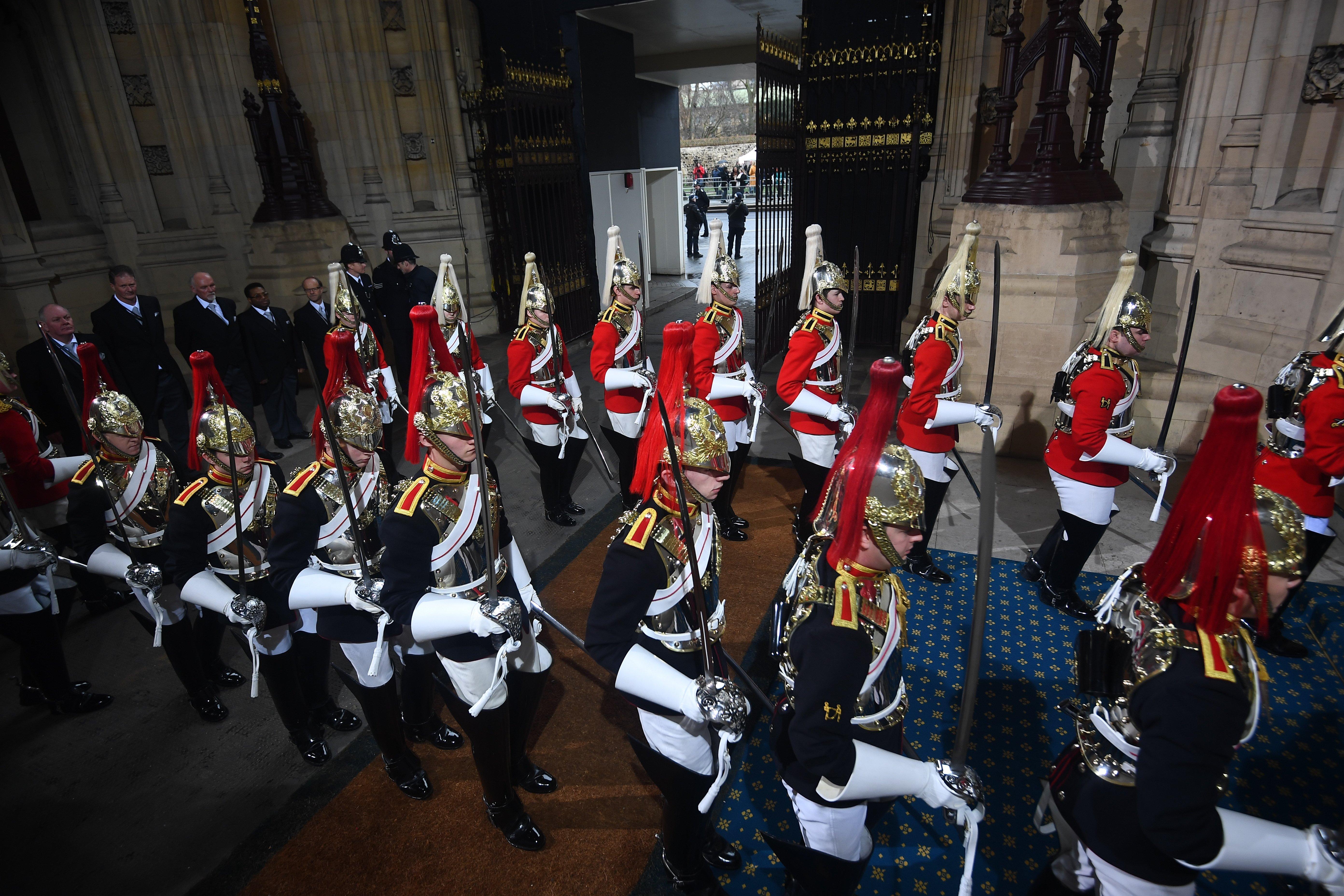 Members of the Household Cavalry parade through the Sovereign's entrance ahead of the State Opening of Parliament by Queen Elizabeth II, in the House of Lords at the Palace of Westminster in London.