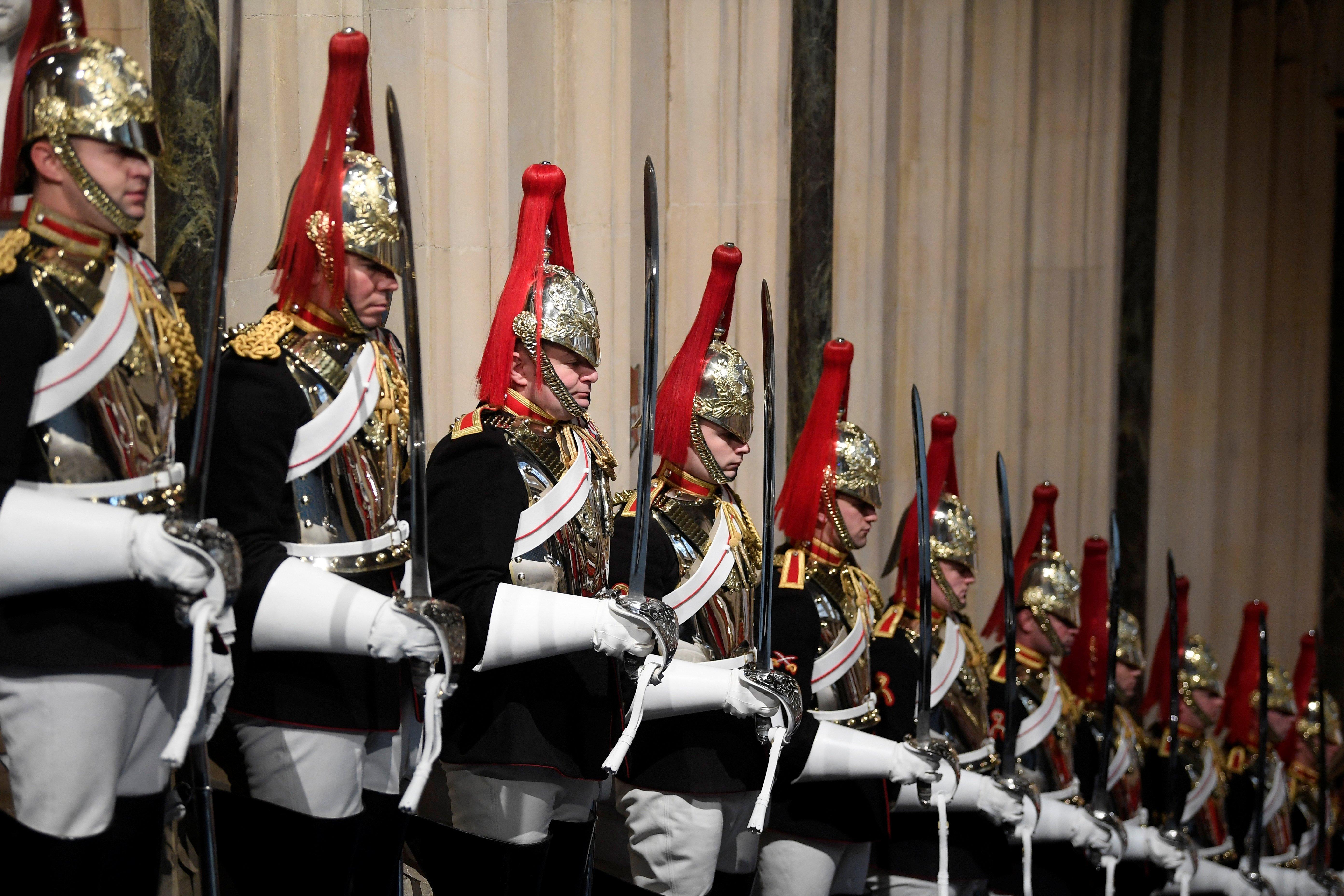 Members of the Blues and Royals stand in the Norman Porch ahead of the State Opening of Parliament by Queen Elizabeth II, in the House of Lords at the Palace of Westminster in London.