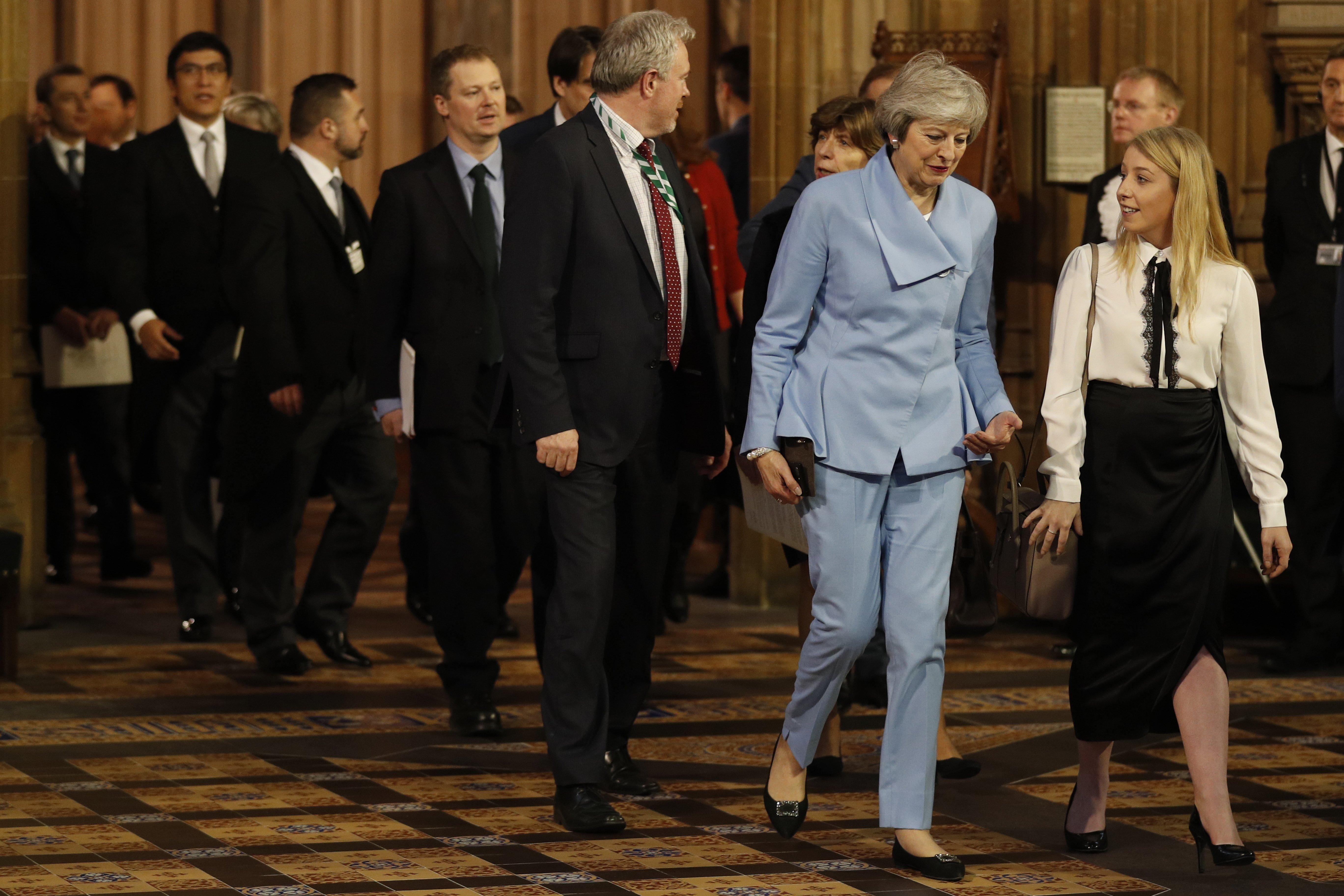 Former prime minister Theresa May walks through Central Lobby after members of parliament were summoned to listen to the Queen's Speech during the State Opening of Parliament by Queen Elizabeth II, in the House of Lords at the Palace of Westminster in London.