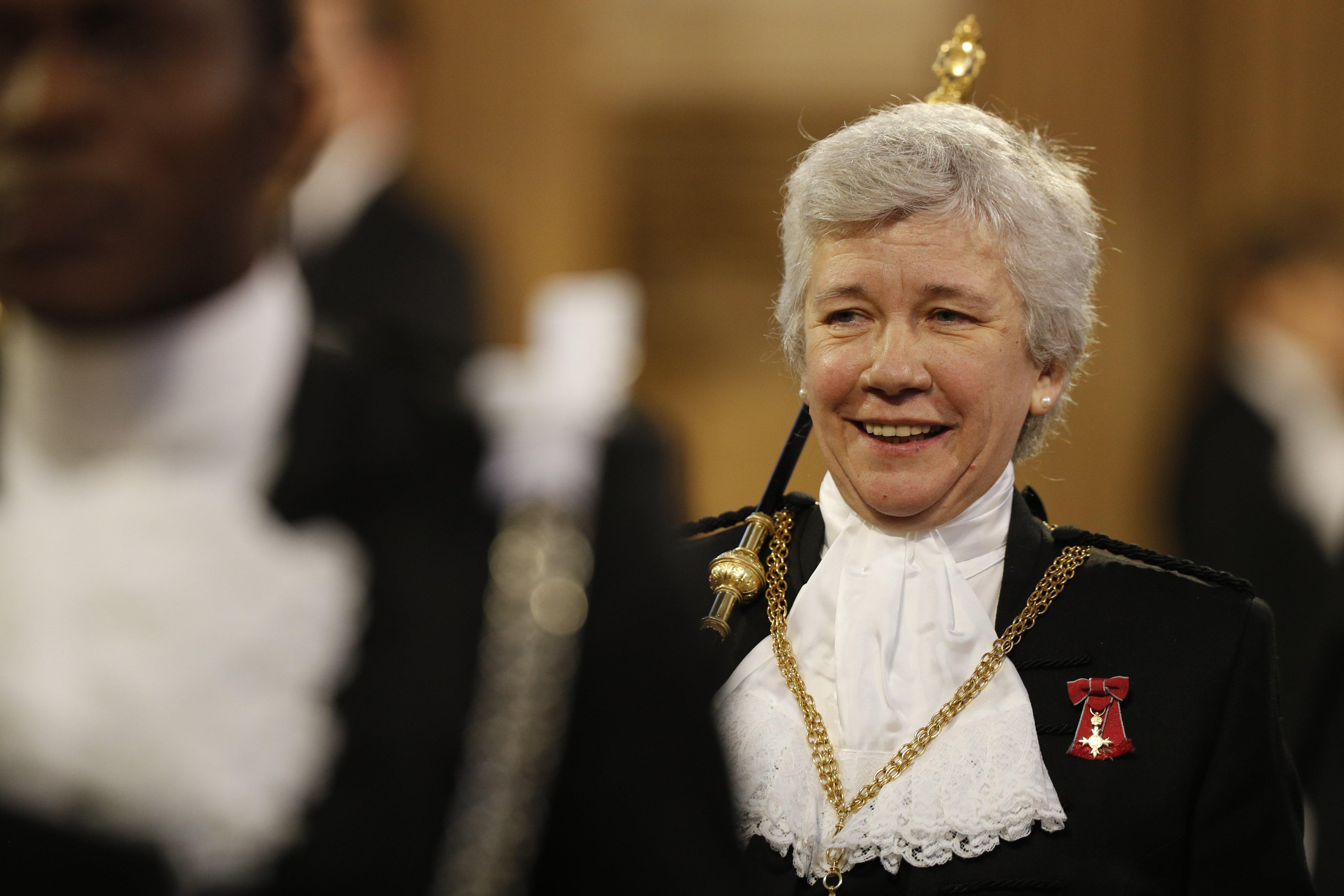 Lady Usher of Black Rod Sarah Clarke heads a procession through the Central Lobby to the Lords chamber during the State Opening of Parliament by Queen Elizabeth II, in the House of Lords at the Palace of Westminster in London.