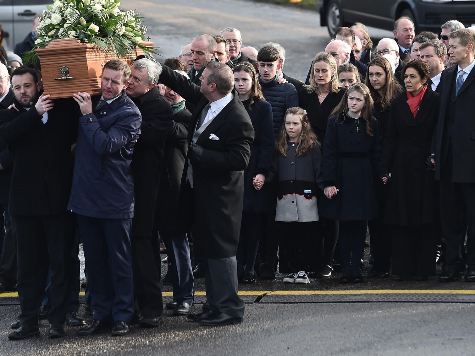 Described as a "great chieftain", former SDLP Deputy Leader, Seamus Mallon, is carried to his final resting place.
