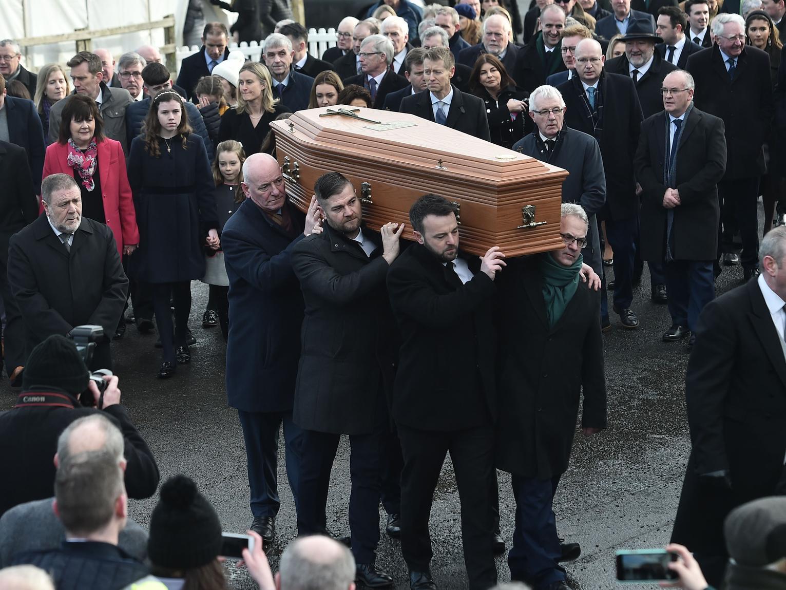 Seamus Mallon is carried to his final resting place in his beloved Co. Armagh.