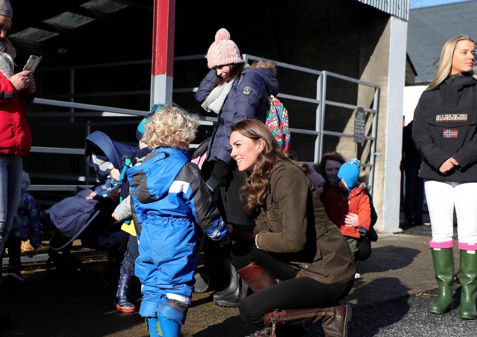 The Duchess of Cambridge meets members of the public at the Ark Open Farm, in Newtownards, near Belfast, during a visit to meet with parents and grandparents to discuss their experiences of raising young children for her Early Childhood survey