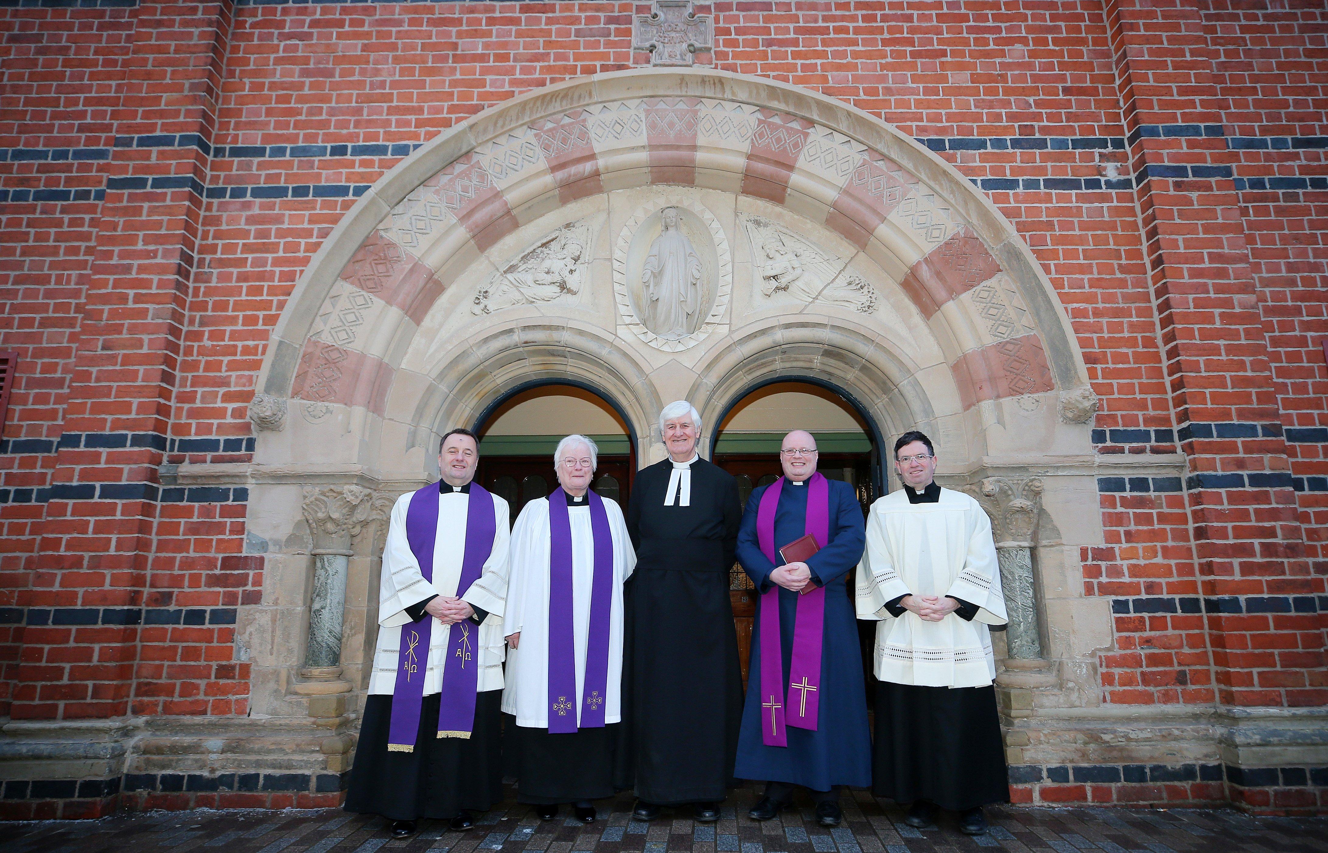 Fr Tim Bartlett, Rev Elizabeth Hanna, Rev Dr Ken Newell, Rev Robin Waugh and Fr Martin Magill meet people outside the church